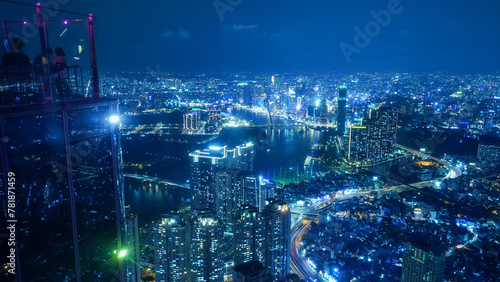 view of the Saigon Ho Chi Minh city at night, blue color traffic road lights and urban connection