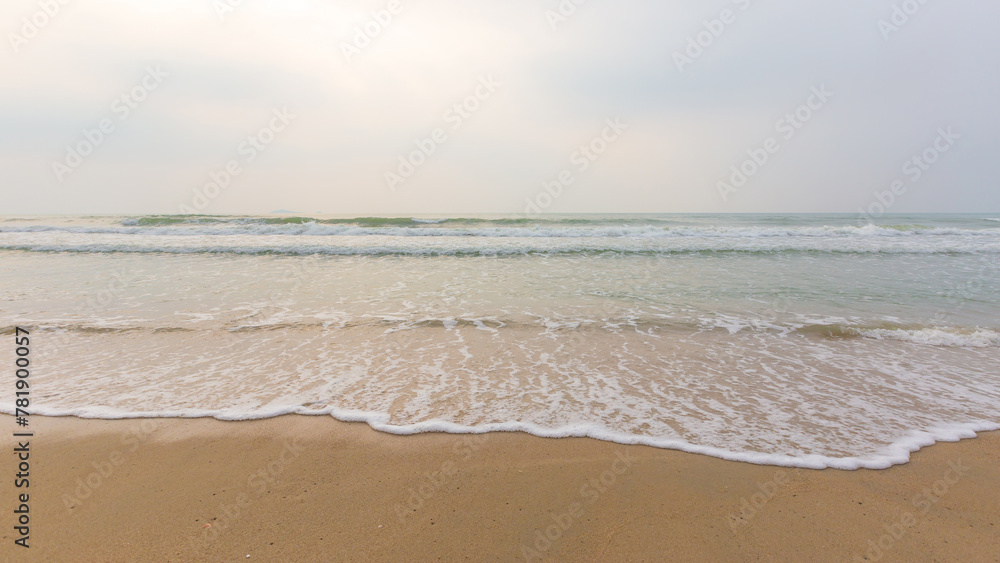 Sea wave water on the sand beach at the morning time.