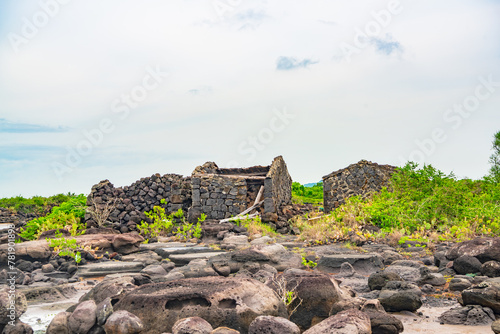 Stone houses and stone piles in the ancient salt fields of Yanding, Danzhou, Hainan, China photo