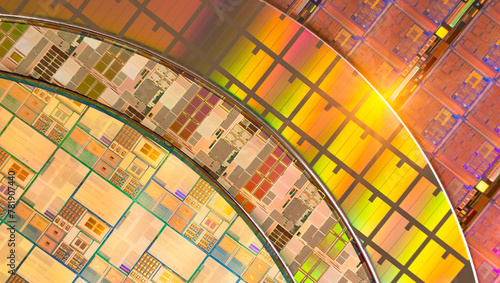 Fotografie Silicon Wafers with microchips reflecting different colors