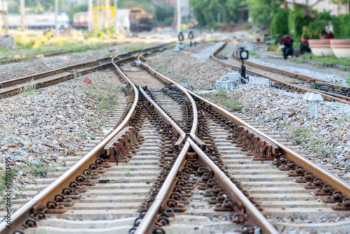 Top aerial view of the railway tracks and railway switches at the distribution station next to the train depot. Looking into the distance perspective