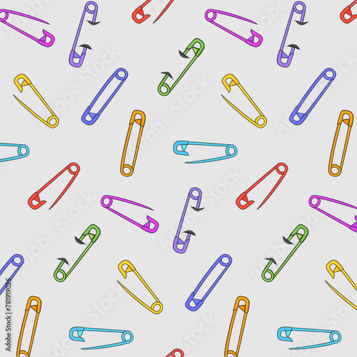 Multi-colored pins on a gray background.Vector seamless pattern with multi-colored safety pins on a gray background.
