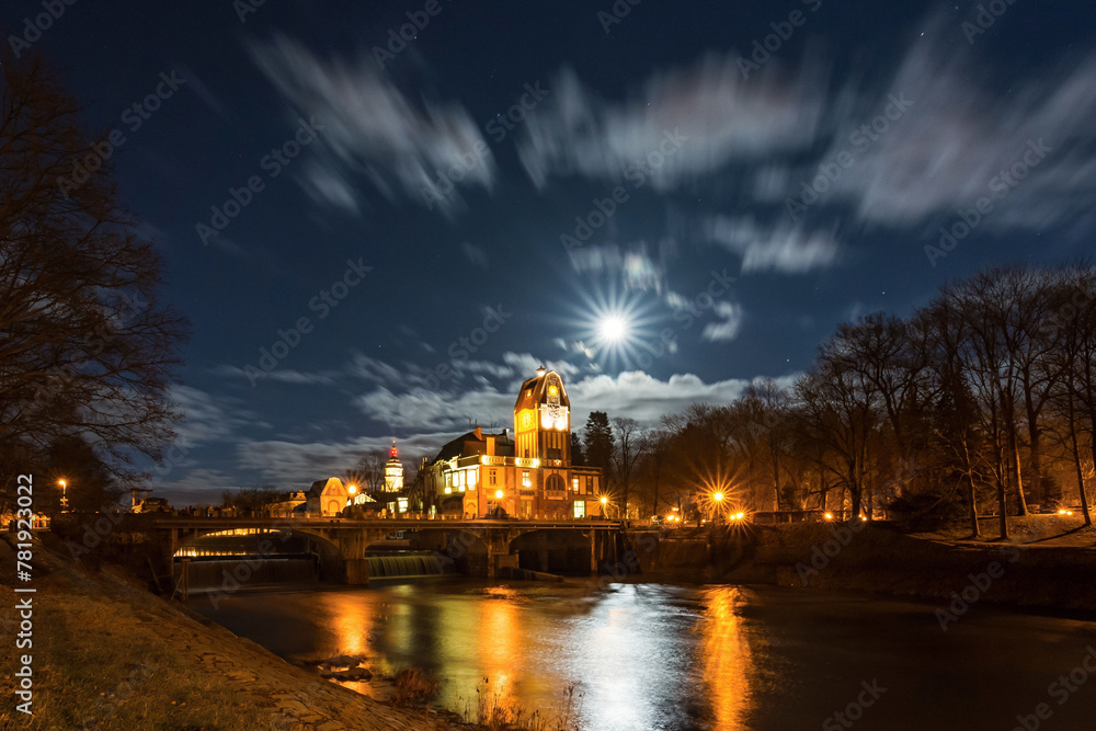 A full moon over a hydroelectric power station on the Elbe River flowing through the beautiful city of Hradec Králové in the Czech Republic