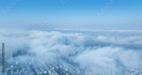 aerial time lapse of the advection fog over the city, Jiujiang, Jiangxi province, China photo