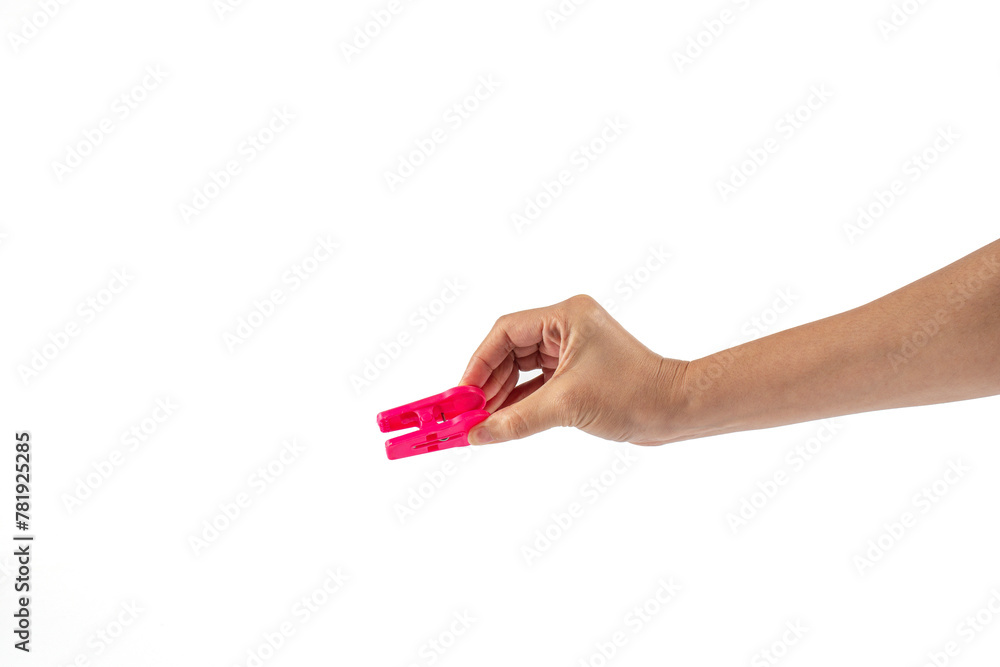 Close up of clothes peg in hand on white background Close up of clothes peg in hand on white background