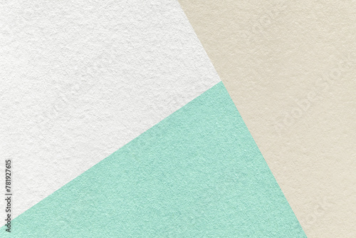 Texture of craft white, beige and cyan paper background, macro. Vintage abstract pastel cardboard