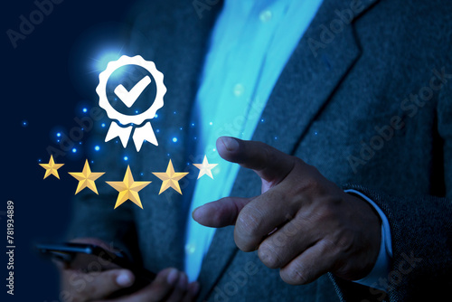 Businessman pointing the best quality assurance with golden five stars for guarantee product. Industry-leading digital technology product performance concept and ISO certification.