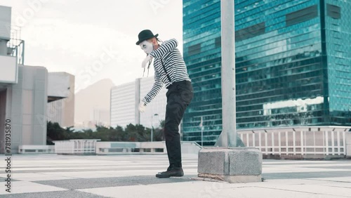 Man, magic and street mime or magician as performer for circus and performance in downtown New York. Outdoor, comedy and funny on costume or face mask as artist for stunt, creative and entertainment photo