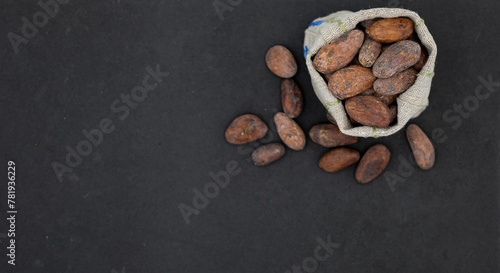 Cocoa beans on a black background. Food. Technology. Business. Price.