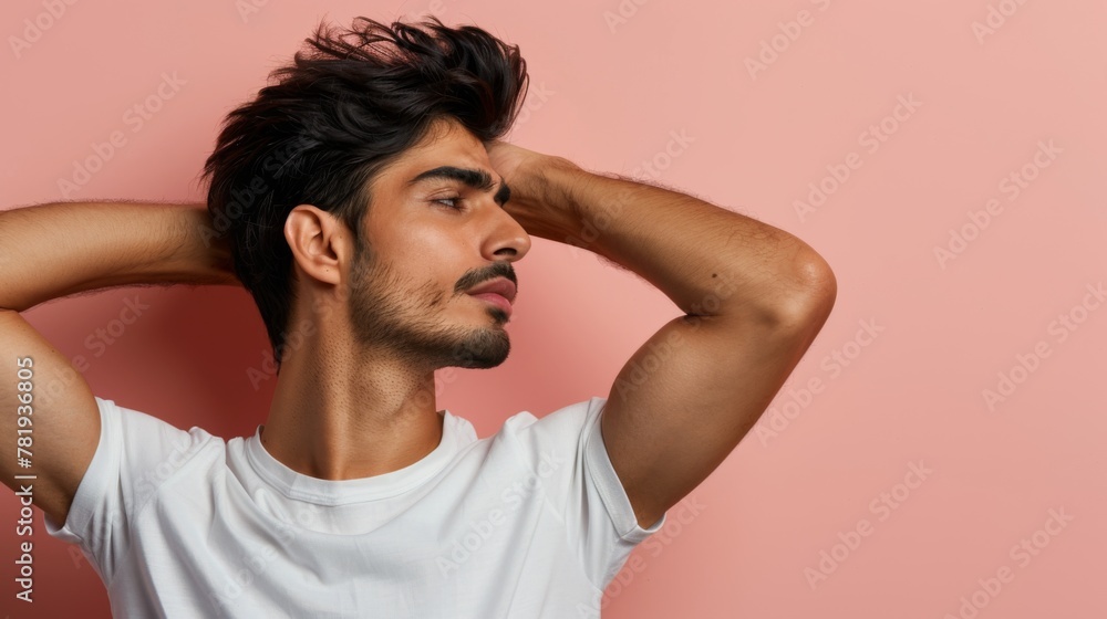 Handsome Young Man Posing in White T-shirt on Pink Background Handsome Young Man Posing in White T-shirt on Pink Background