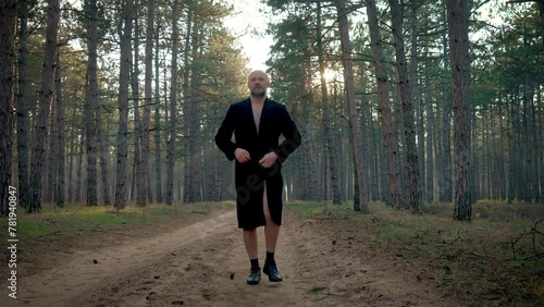 Male pervert in park, man exhibitionist opens coat in forest showing his underwear. Psychological disorders, sexual upbringing issues, emotional disturbances, depression