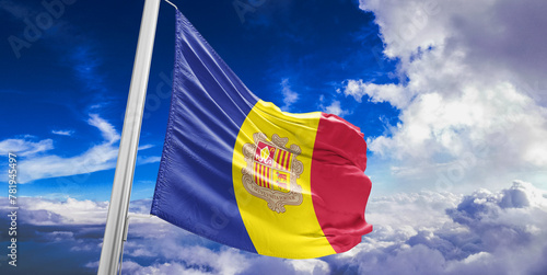 Andorra national flag cloth fabric waving on beautiful Blue Sky Background.