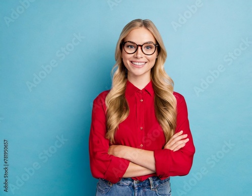 portrait young woman isolated on blue background in red shirt student girl