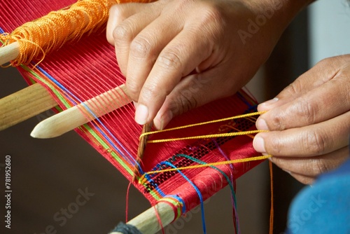 Tourist learning back strap weaving in Guatemala photo