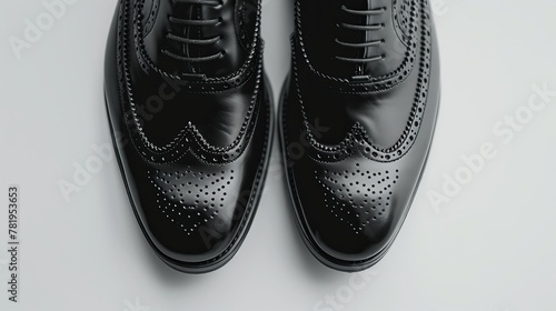 close-up Men's black shoes against a white backdrop. photo