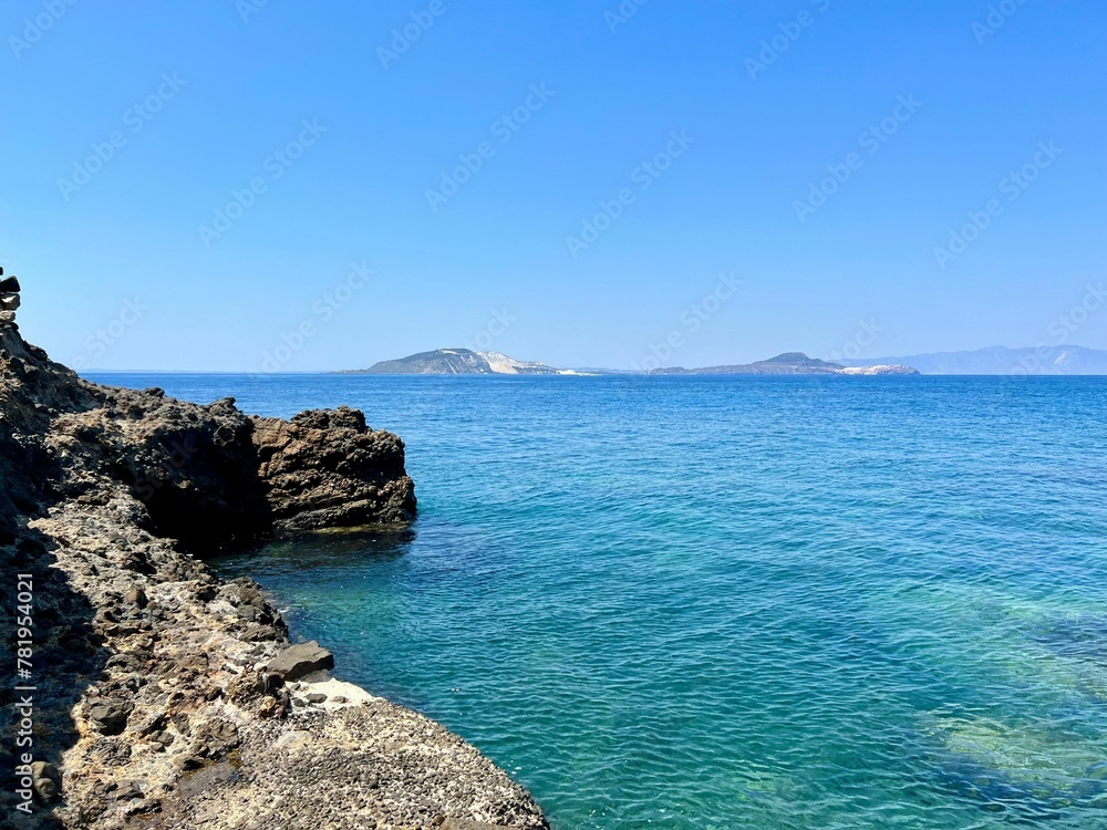 View of a rocky blue seacoast in Greece