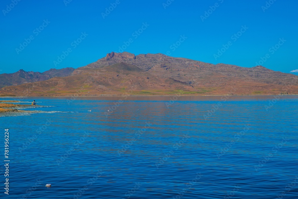 Scenic view of a mountain at Lake Urmia in Iran under a cloudless blue sky on a sunny day