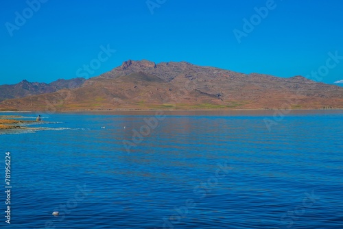 Scenic view of a mountain at Lake Urmia in Iran under a cloudless blue sky on a sunny day