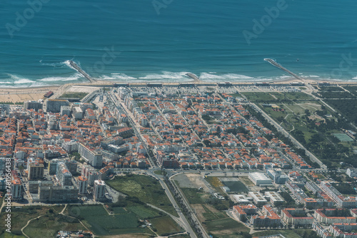 The Aerial footage of Costa da Caparica coastline of glorious sandy beaches, powerful Atlantic waves. Portugal
