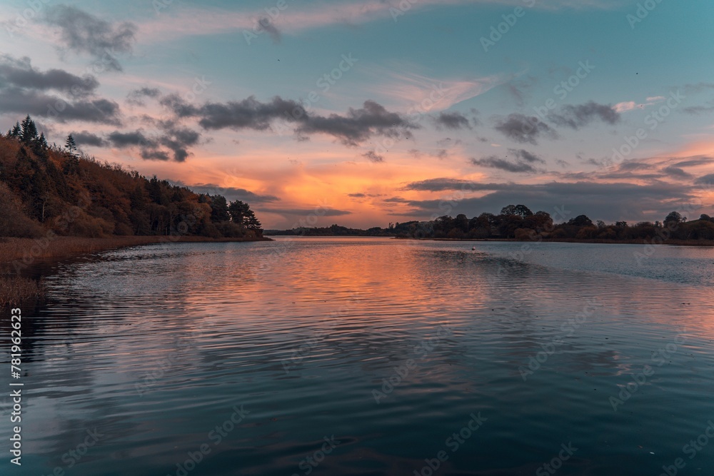Scenic lake Muckno in County Monaghan with sunset reflecting on the water surface