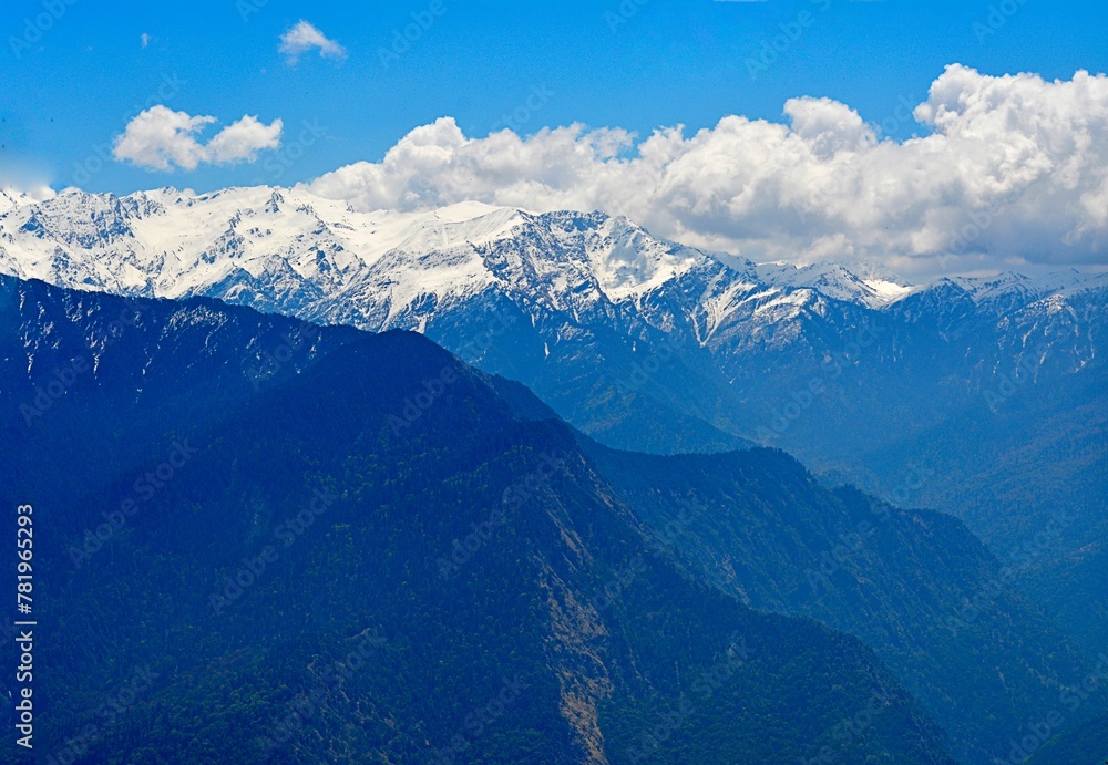 Beautiful landscape with snow mountain and blue cloudy sky Beautiful landscape with snow mountain and blue cloudy sky