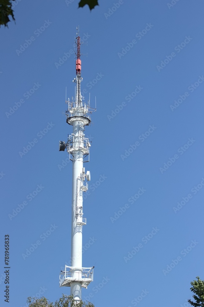 Vertical shot of the Radio broadcasting mast against the blue sky