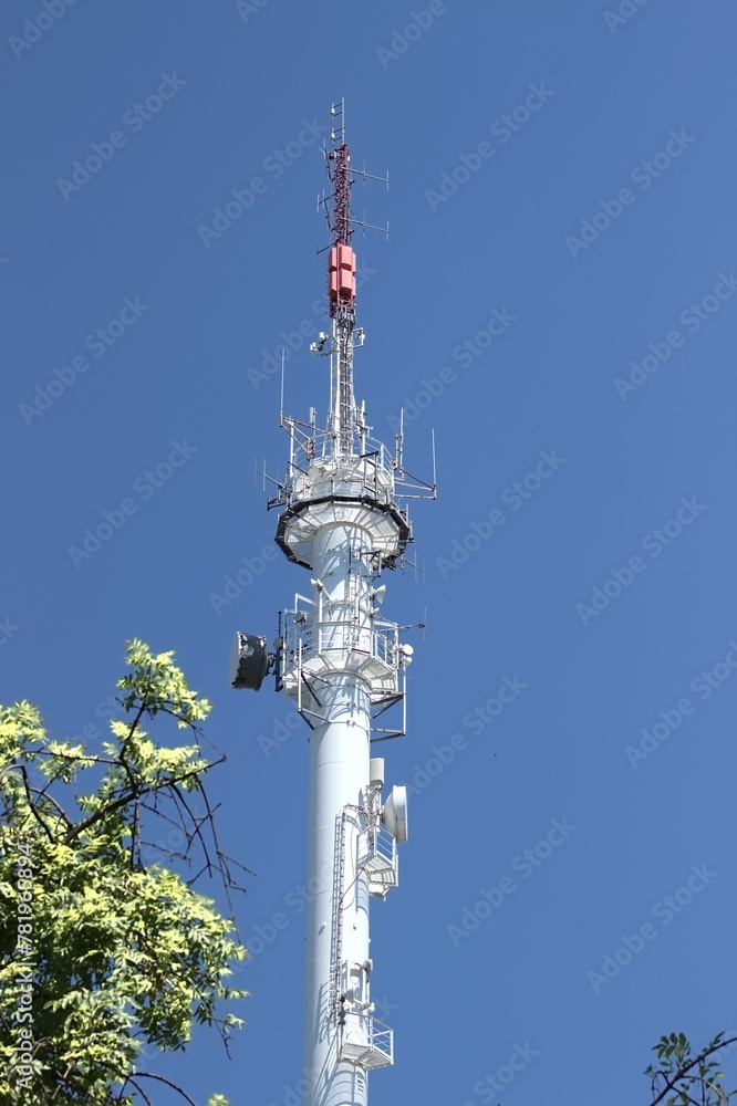 Vertical shot of the Radio broadcasting mast against the blue sky