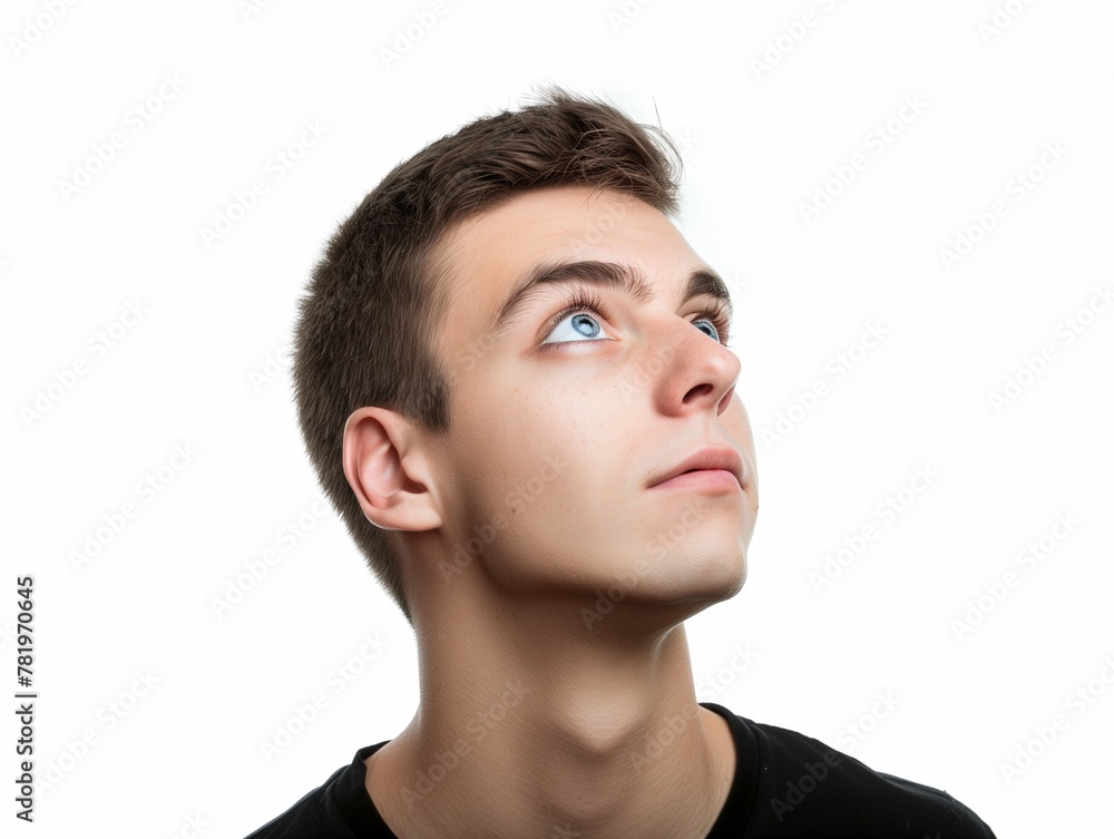 Young man looking up on white background, closeup portrait of face with eyes and eyebrows, handsome young guy, brown hair, studio shot, high resolution photography Young man looking up on white background, closeup portrait of face with eyes and eyebrows, handsome young guy, brown hair, studio shot, high resolution photography