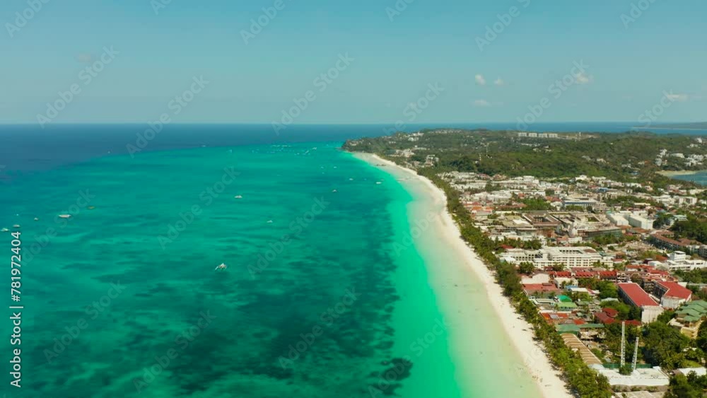 Tropical white beach with tourists and hotels near the blue sea, aerial view. Summer and travel vacation concept. Tropical white beach with tourists and hotels near the blue sea, aerial view. Summer and travel vacation concept.