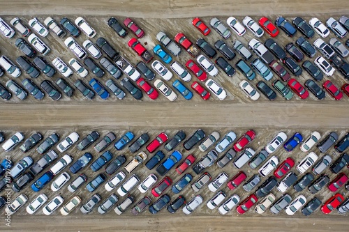 Aerial top view of cars parked densely in a parking lot photo