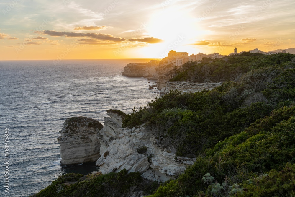 Beautiful landscape of rocky cliffs facing the sea during the sunset