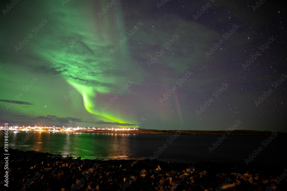 Beautiful shot of the Northern Lights over a sea in Vardo, Norway