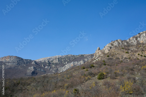 Mountains in spring Crimea against a background of blue sky and bright sunlight photo