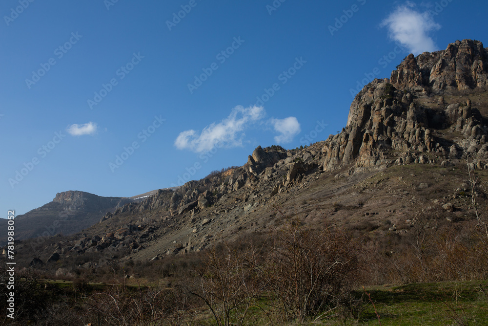 Mountains in spring Crimea against a background of blue sky and bright sunlight