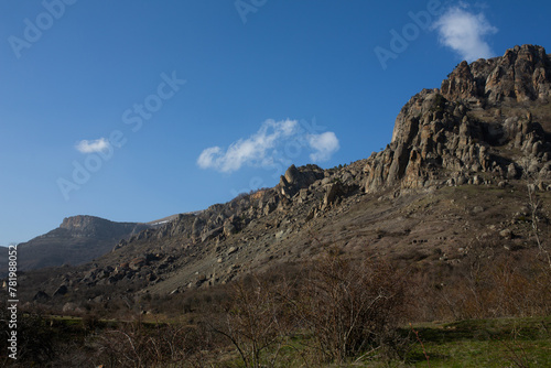Mountains in spring Crimea against a background of blue sky and bright sunlight