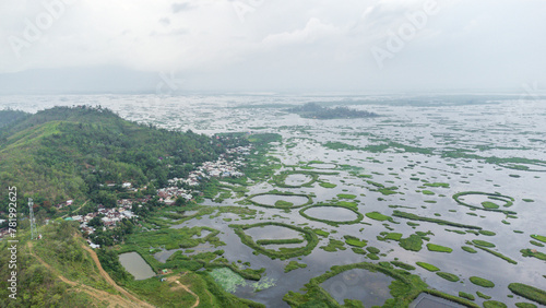 Aerial view loktak lake is the largest freshwater lake and thanga village in India as well as the largest lake in North East India. photo