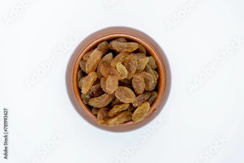 Raisins Filled Bowl, Top View, Isolated On White Background