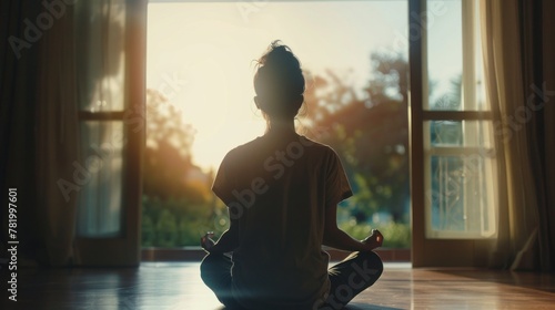 A person feeling peaceful and centered after a session of meditation.