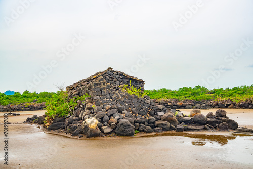 Stone houses and stone piles in the ancient salt fields of Yanding, Danzhou, Hainan, China photo