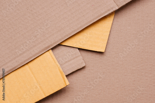 Part of 5 Cardboard paper sheets stacked in geometric pattern background in table top view, Flat lay with copy space
