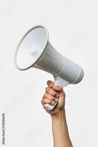 A hand holding a white megaphone on a white background. Copy space.