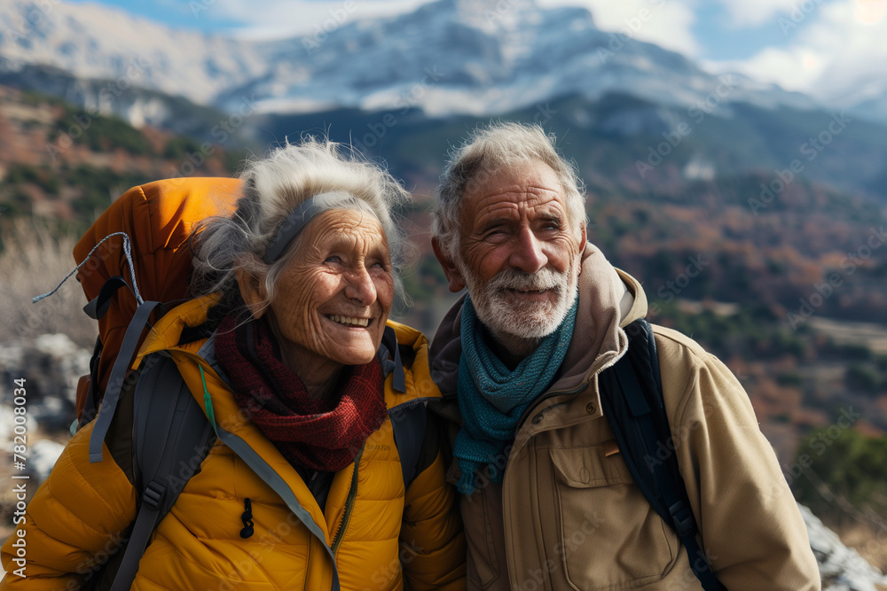 An elderly couple goes on a mountain hike