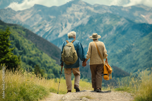 An elderly couple goes on a mountain hike © Juri