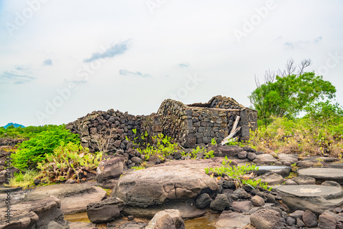 Stone houses and stone piles in the ancient salt fields of Yanding, Danzhou, Hainan, China photo