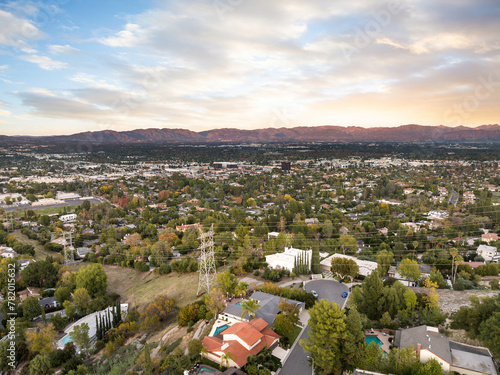 Aerial view of a small town and valley at sunset in Encino, California photo