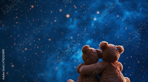 Two teddy bears cuddling under the starry sky. The concept of friendship and selfless love. photo