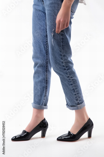 Elegant Casual Fashion Banner: Trendy Rolled Up Jeans and Classic Black Heels