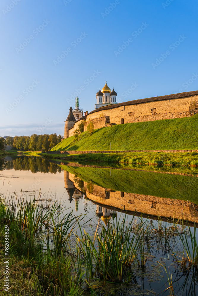 Pskov, Russia, September 11, 2023. View of the fortress walls and domes of the cathedral.