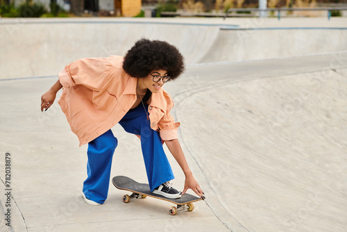 A young African American woman with curly hair skateboarding in a lively skate park, showcasing skills on the skateboard.