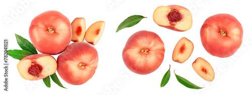 Ripe chinese flat peach fruit and half with leaf isolated on white background. Top view. Flat lay © kolesnikovserg